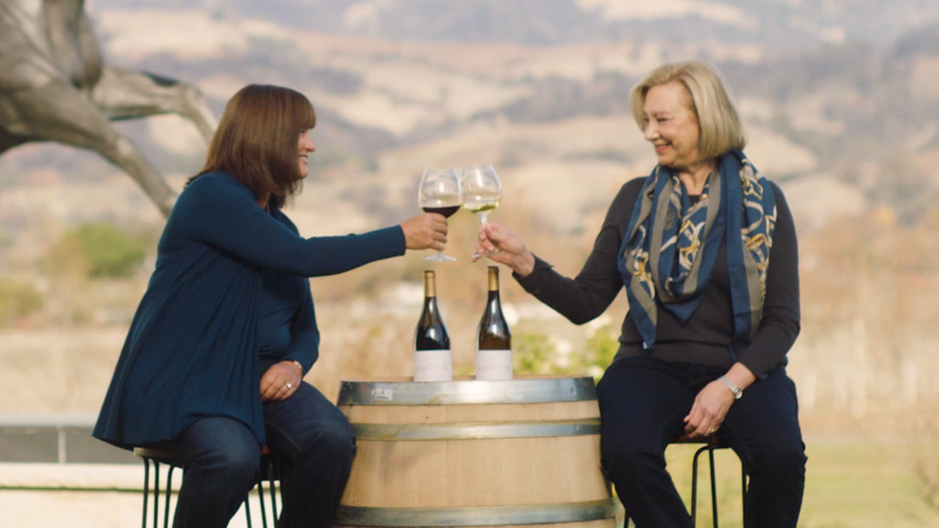 two women drinking wine