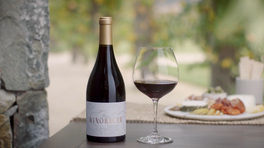 Red wine bottle with glass